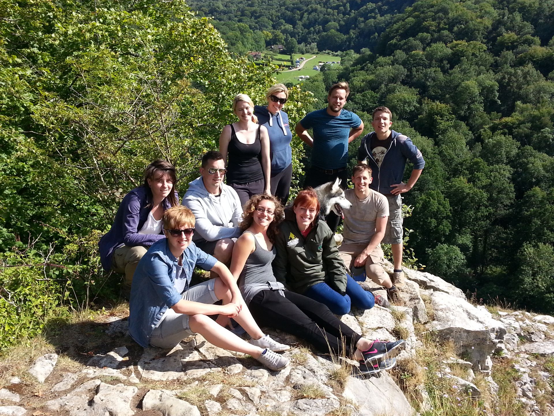 A group sat on Seven Sisters Rocks on a guided walk