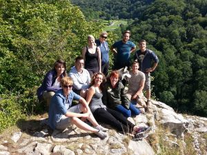 A group sat on Seven Sisters Rocks on a guided walk