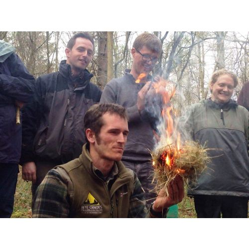 A Wye Adventures instructor demonstrating fire by friction.